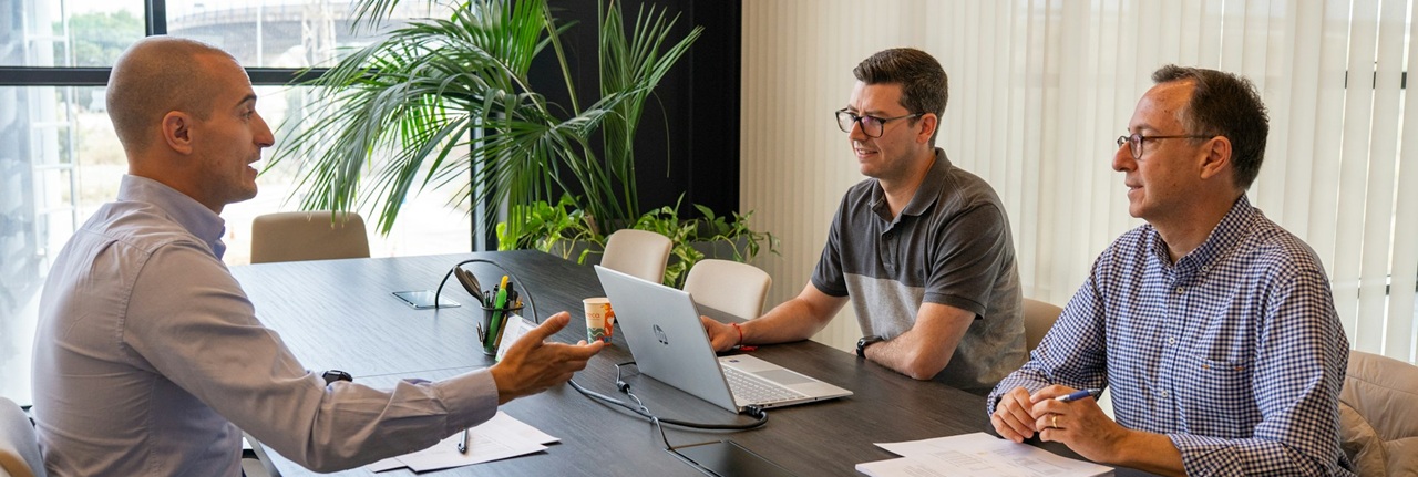 Colleagues discussing an asset management investment